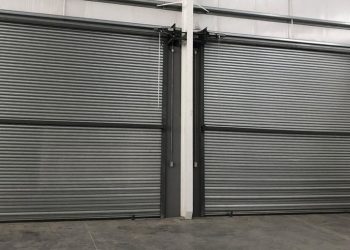 Cook holding glass of red wine